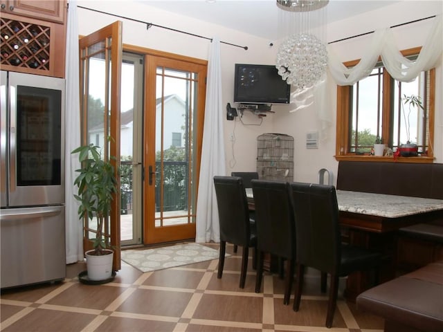 dining space with a chandelier