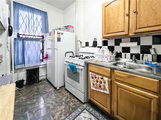 kitchen with white appliances and sink