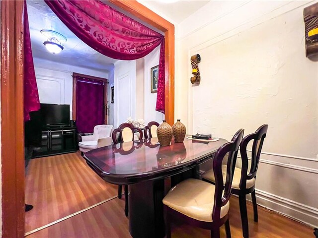 dining room featuring wood-type flooring