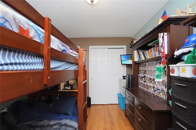 bedroom featuring a closet and light hardwood / wood-style flooring