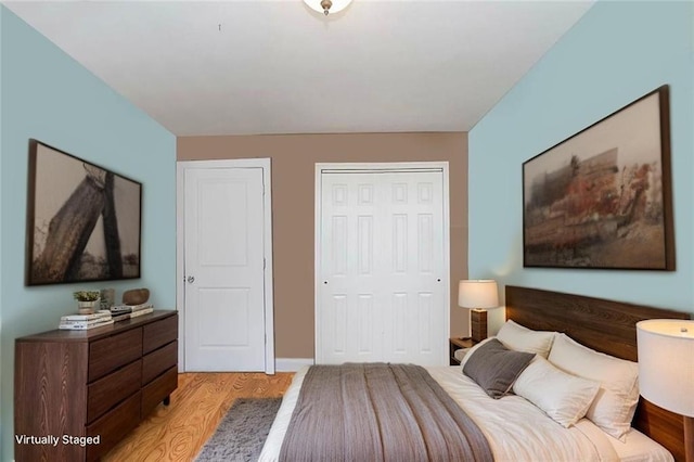 bedroom featuring light wood-style flooring