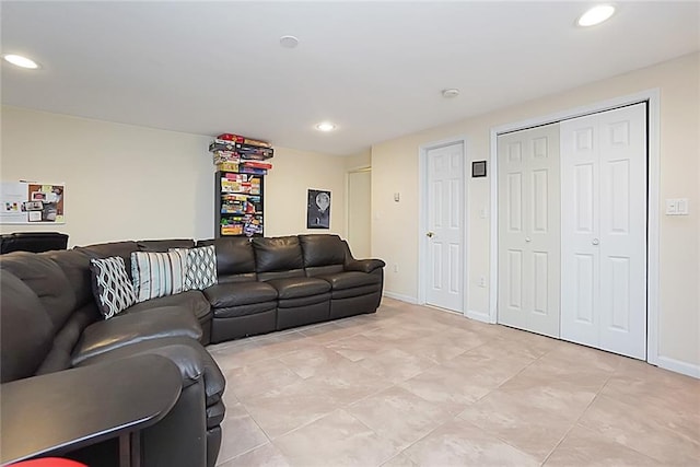 living room featuring recessed lighting, light tile patterned floors, and baseboards