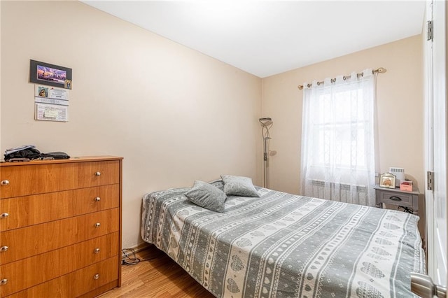 bedroom with light hardwood / wood-style floors