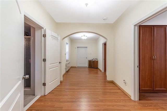 hallway with light wood-type flooring