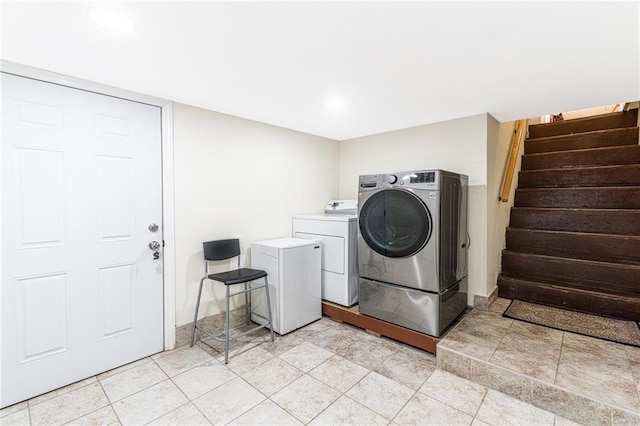 washroom with washer and dryer