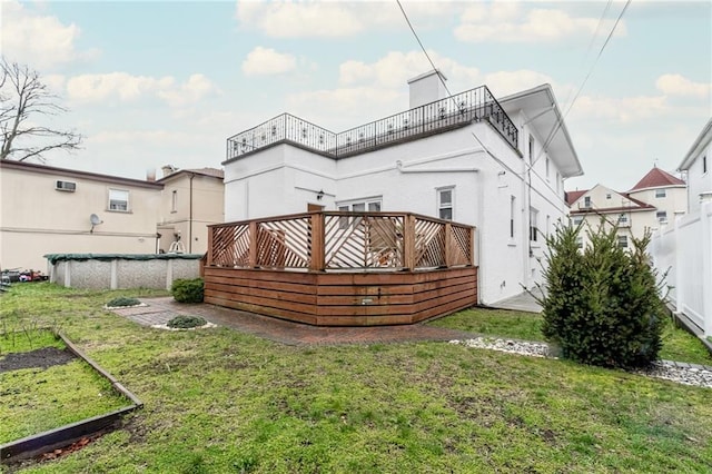 back of property featuring a yard and a covered pool