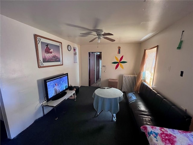 living room with radiator and ceiling fan