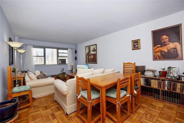 living room with light parquet flooring and cooling unit