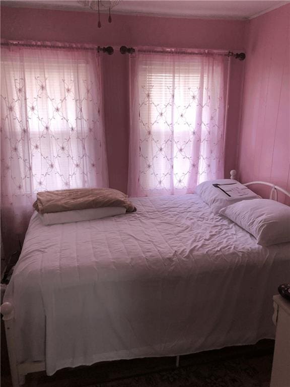 bedroom with ornamental molding