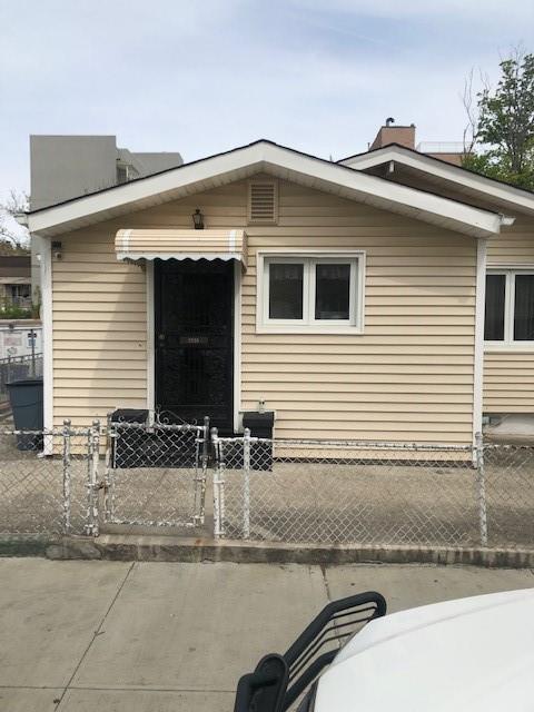 view of front of house featuring a gate and fence