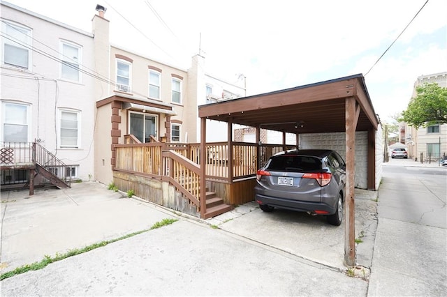 view of parking / parking lot with a carport