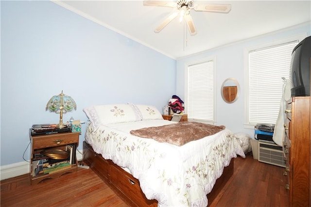 bedroom with dark wood-type flooring, ceiling fan, and crown molding