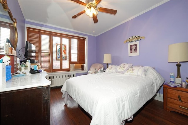 bedroom featuring multiple windows, ceiling fan, radiator heating unit, and dark hardwood / wood-style flooring