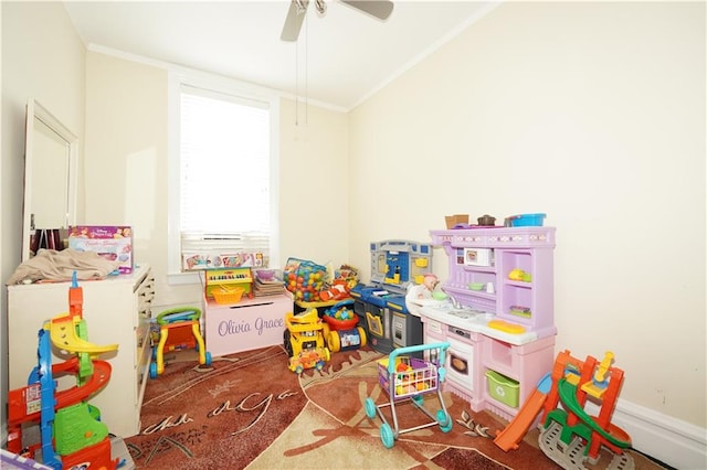 playroom with ceiling fan and crown molding