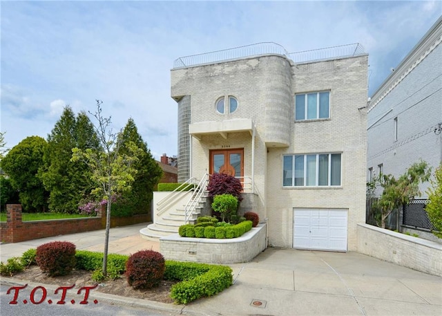 view of front of property with a garage and french doors