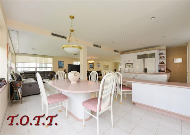 dining area with light tile patterned floors