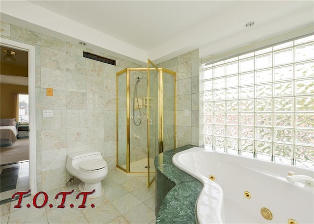 bathroom featuring tile patterned flooring, tile walls, independent shower and bath, and toilet