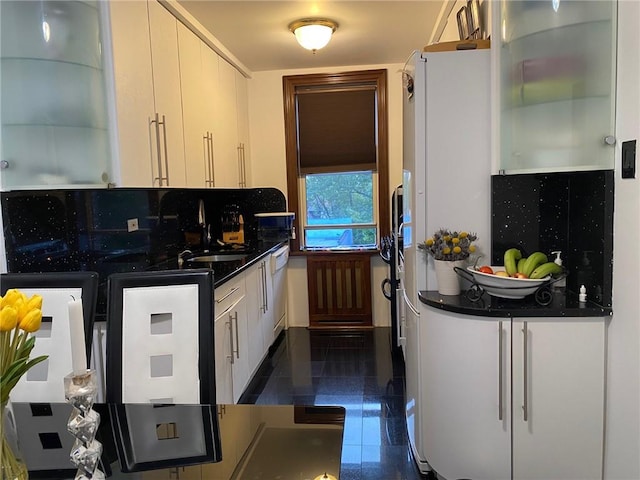 kitchen with dishwasher, sink, and decorative backsplash