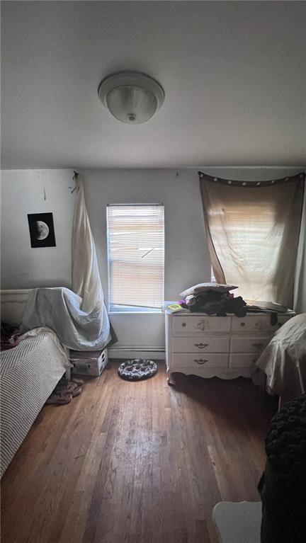 bedroom featuring wood finished floors