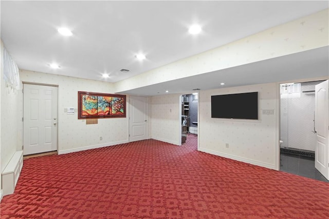 basement featuring dark carpet