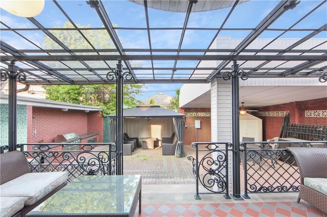 view of patio featuring a gazebo, a grill, and an outdoor hangout area