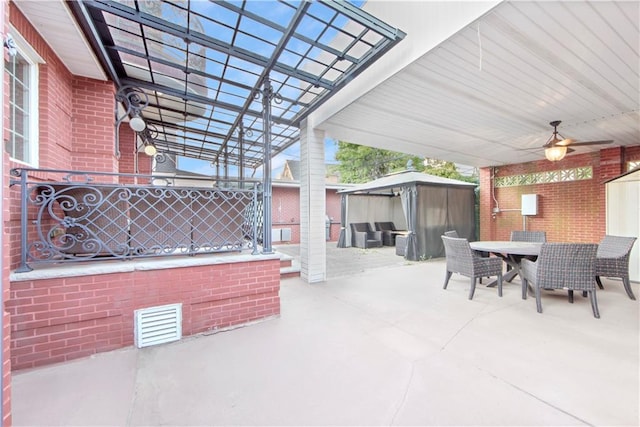 view of patio featuring ceiling fan