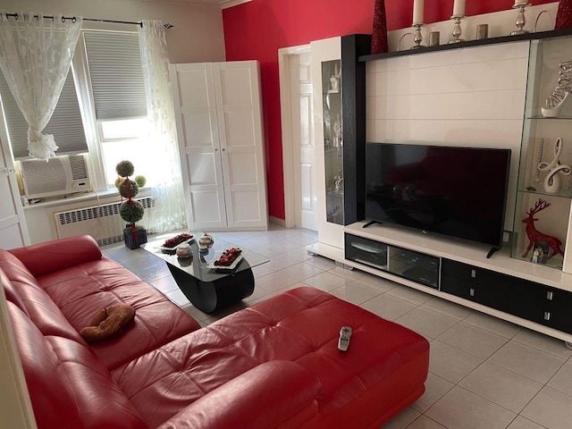 living room with light tile floors and radiator