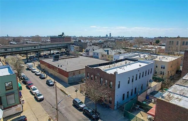 drone / aerial view featuring a city view