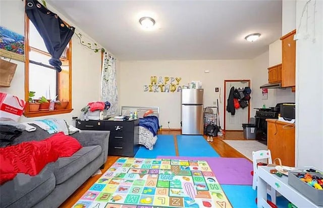 game room featuring light wood-style flooring