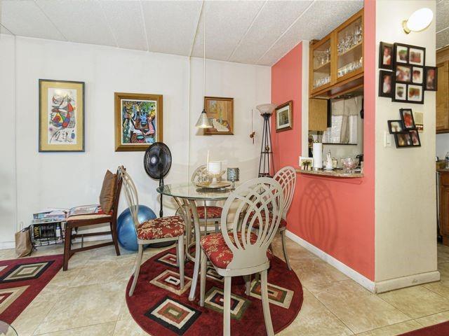 dining area with light tile patterned floors