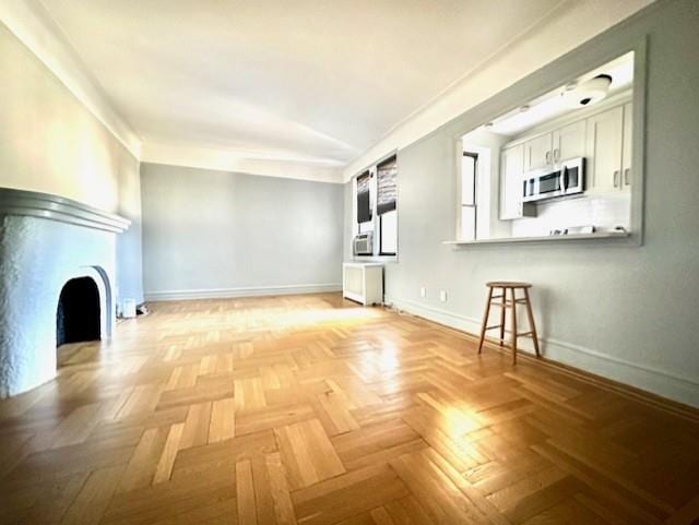 8020 4th Ave Unit D5, Brooklyn, NY 11209 - unfurnished living room with baseboards
