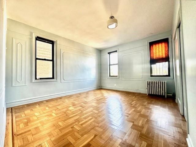 8020 4th Ave Unit D5, Brooklyn, NY 11209 - spare room featuring radiator and baseboards
