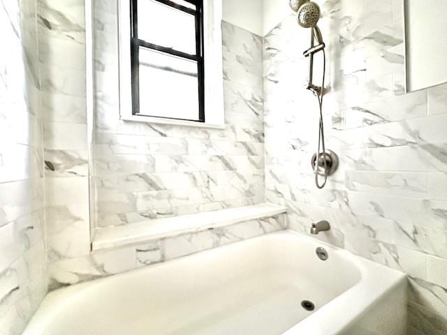 8020 4th Ave Unit D5, Brooklyn, NY 11209 - bathroom featuring plenty of natural light and tub / shower combination