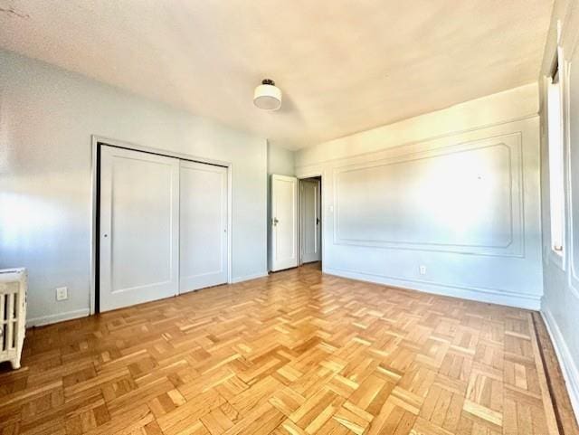 8020 4th Ave Unit D5, Brooklyn, NY 11209 - unfurnished bedroom with a closet and baseboards
