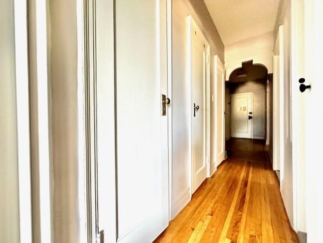 8020 4th Ave Unit D5, Brooklyn, NY 11209 - hallway with light wood-style flooring
