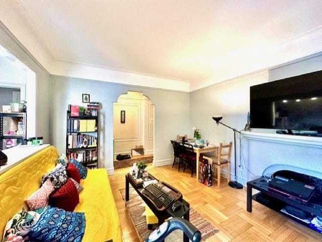 8020 4th Ave Unit D5, Brooklyn, NY 11209 - living area featuring arched walkways, crown molding, and baseboards