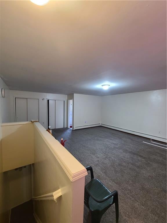 interior space featuring dark carpet