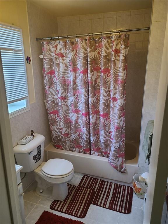 full bathroom featuring toilet, shower / bathtub combination with curtain, and a healthy amount of sunlight