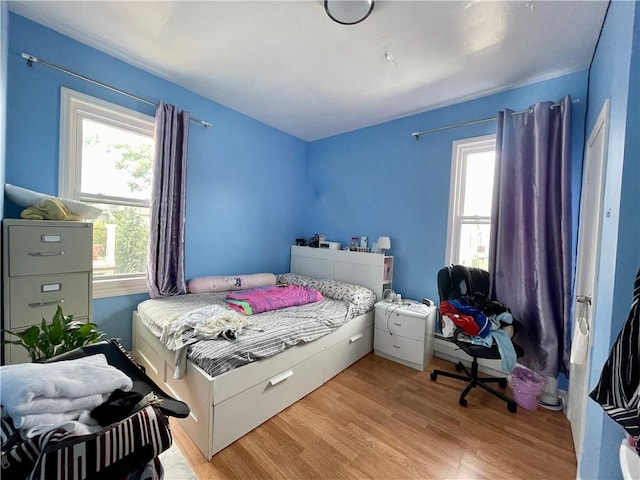 bedroom with light wood-style flooring