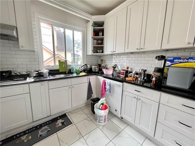 kitchen with dark countertops, white cabinetry, decorative backsplash, and open shelves