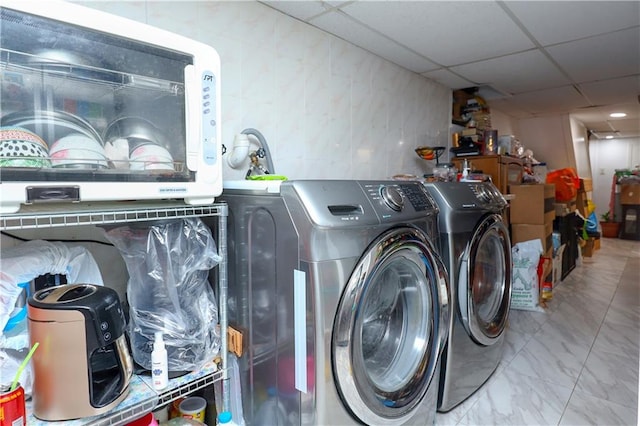 laundry room with washing machine and clothes dryer