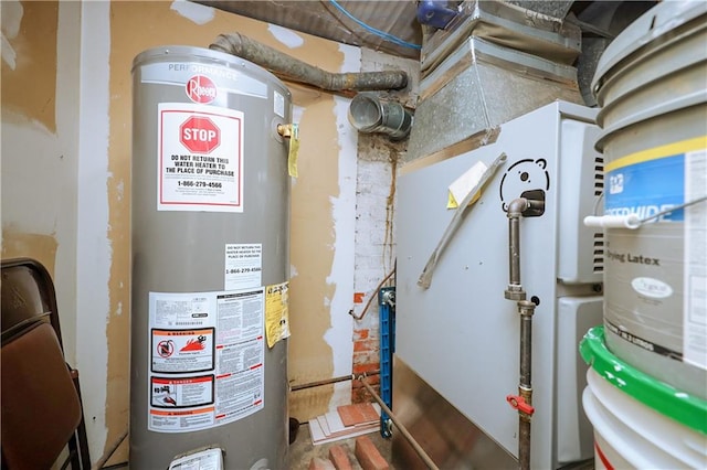 utility room featuring gas water heater