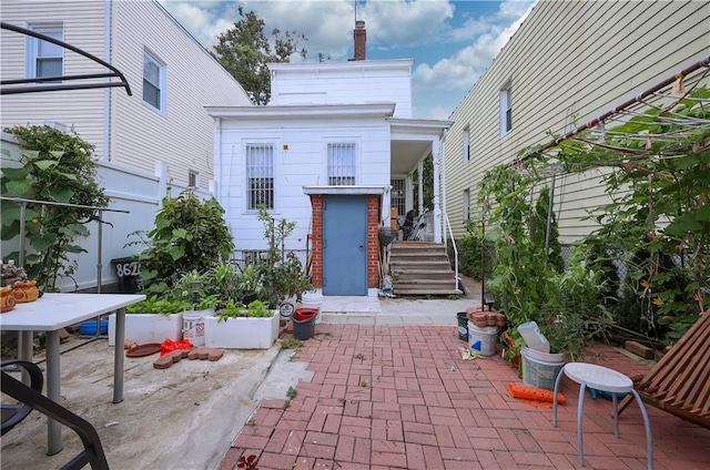 rear view of property with a patio