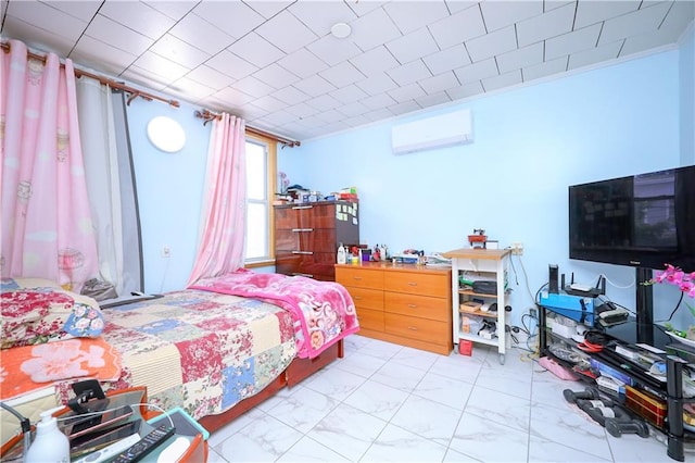 bedroom with an AC wall unit