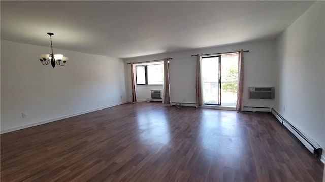 unfurnished room with a wall mounted AC, dark hardwood / wood-style flooring, a baseboard heating unit, and a notable chandelier