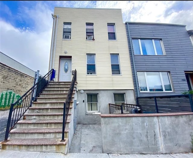 128 19th St, Brooklyn, NY 11232 - view of front of property featuring fence and stucco siding