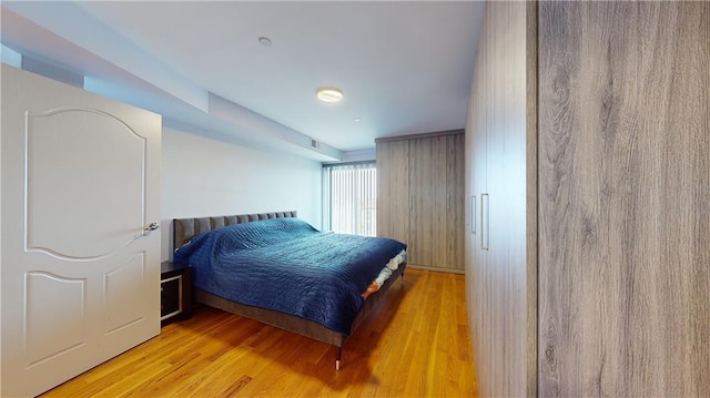 bedroom with light hardwood / wood-style flooring