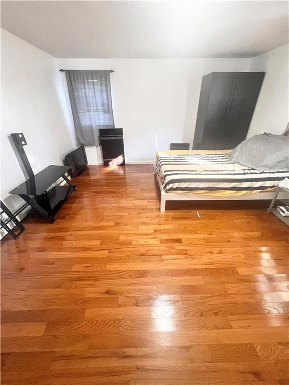 unfurnished bedroom featuring light wood-type flooring