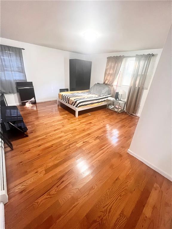 bedroom with light hardwood / wood-style flooring