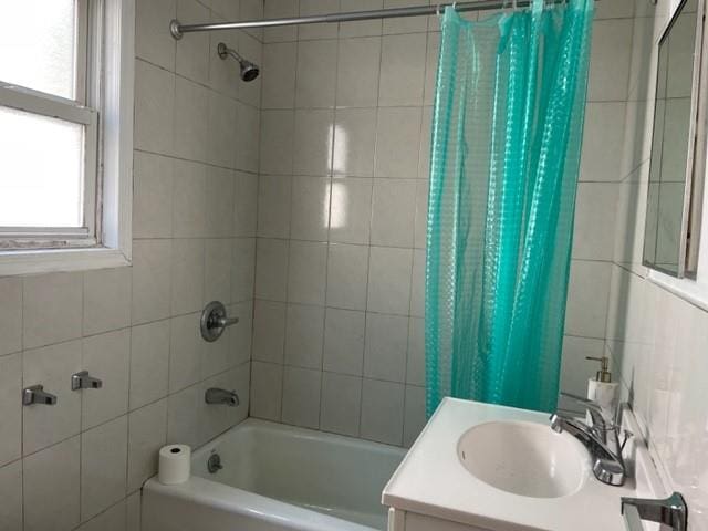 bathroom featuring vanity and shower / tub combo